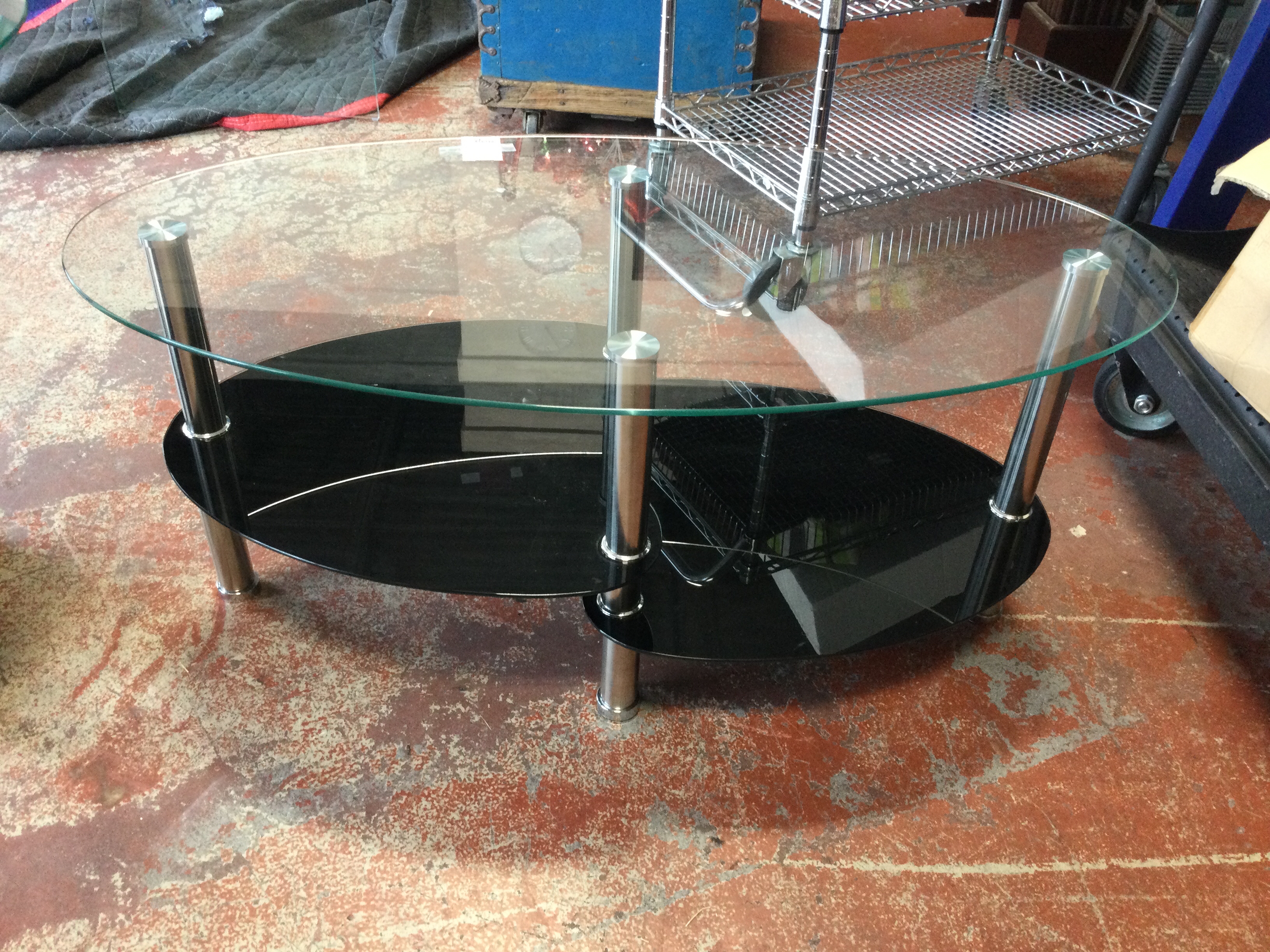 37-Oval--Glass-Coffee-Table-w2-Shelves-Black-and-Stainless-Base_126340A.jpg