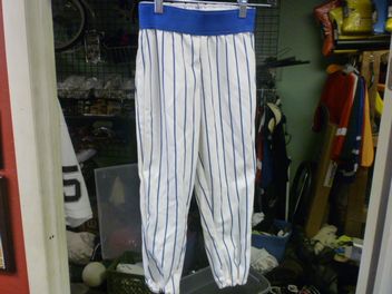 gray baseball pants with blue stripe